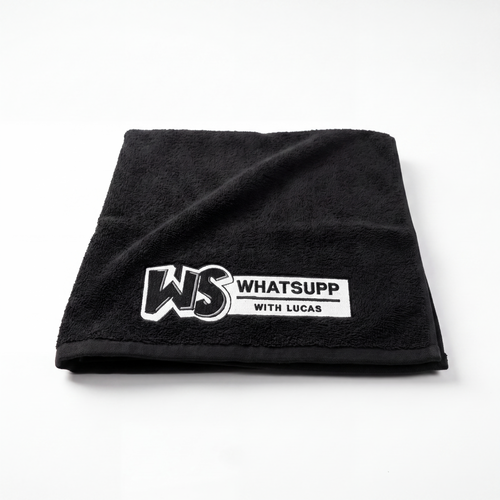 Black Whatsuppwithlucas gym towel folded flat in a square, embroidered WS logo in the corner