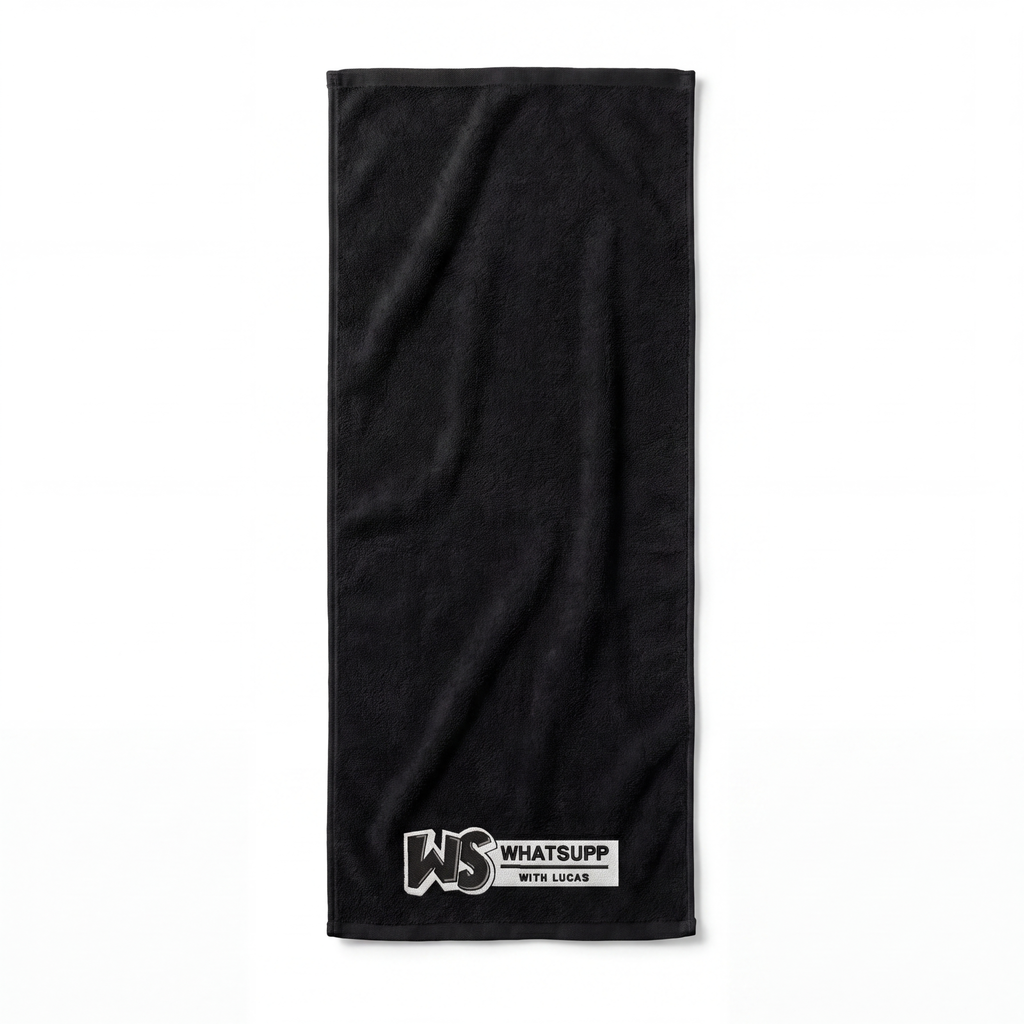 Black Whatsuppwithlucas gym towel fully unfolded and laid flat, showing its full length